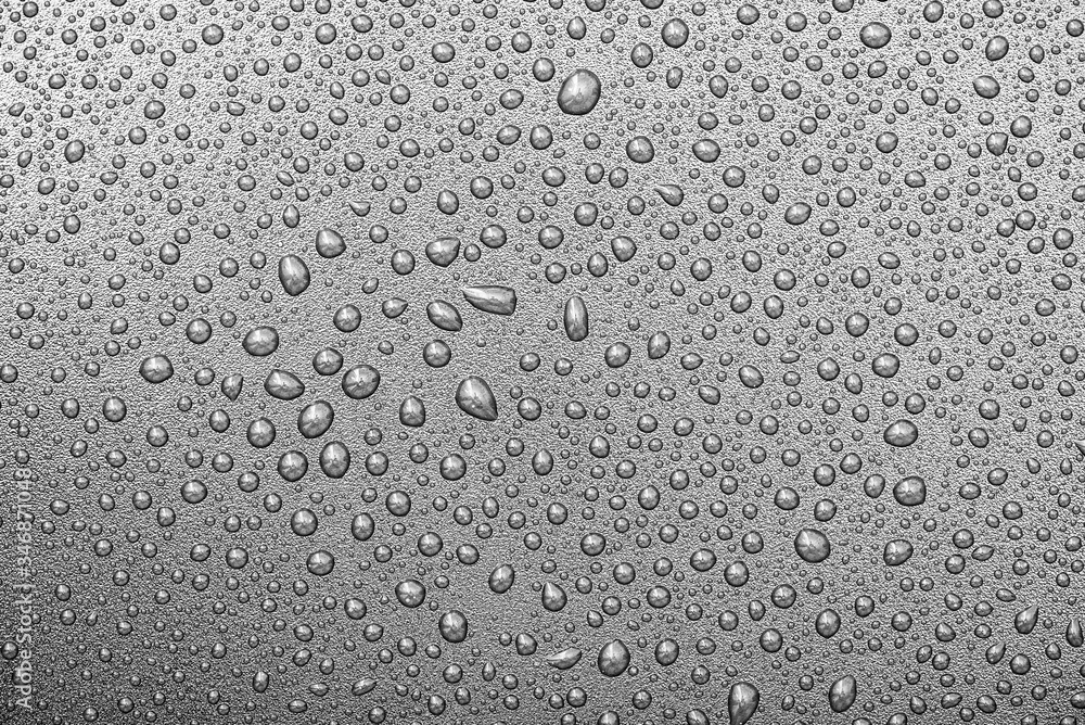 Close-up water  drops on surface of grey backdrop or background, water texture, top view, high resolution