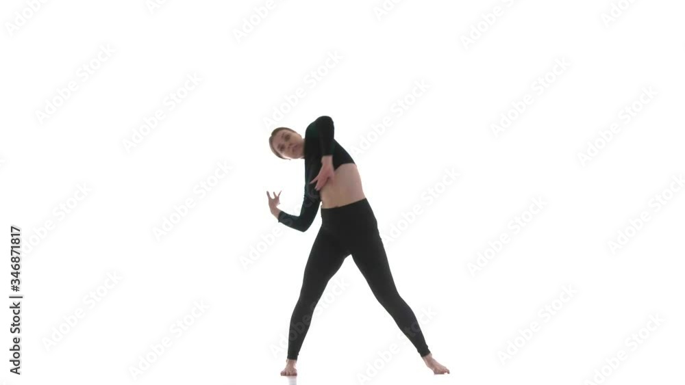 young beautiful girl dancer in black short top and black leggings dancing contemporary, modern ballet dance, isolated, slow motion young beautiful girl dancer in black short top and black leggings dancing contemporary, modern ballet dance, isolated, slow motion
