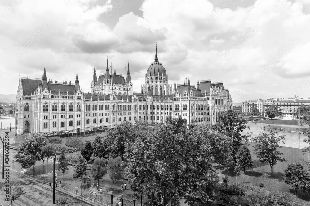 Hungarian parliament building from behind on a sunny day in summer season in Budapest, Hungary - aerial view.