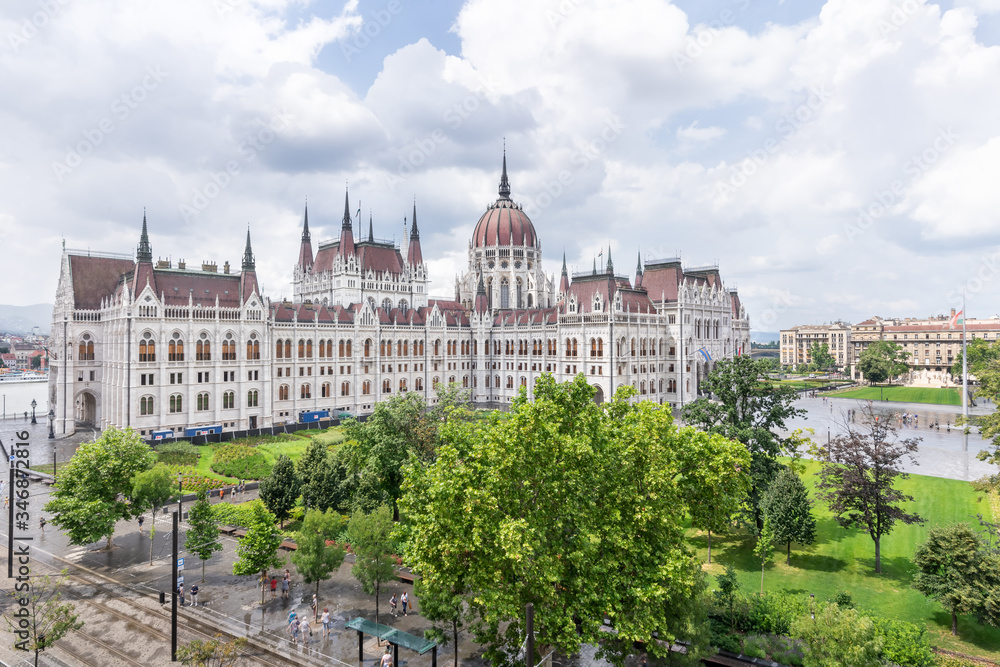 Hungarian parliament building from behind on a sunny day in summer season in Budapest, Hungary - aerial view.