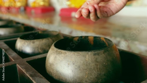 Wallpaper Mural Man hand put coin in monk's alms-bowl. Buddhist culture for good luck and make merit. Torontodigital.ca