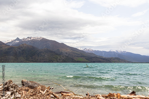 Views of Wanaka lake. Snow, stones and water. South Island, New Zealand