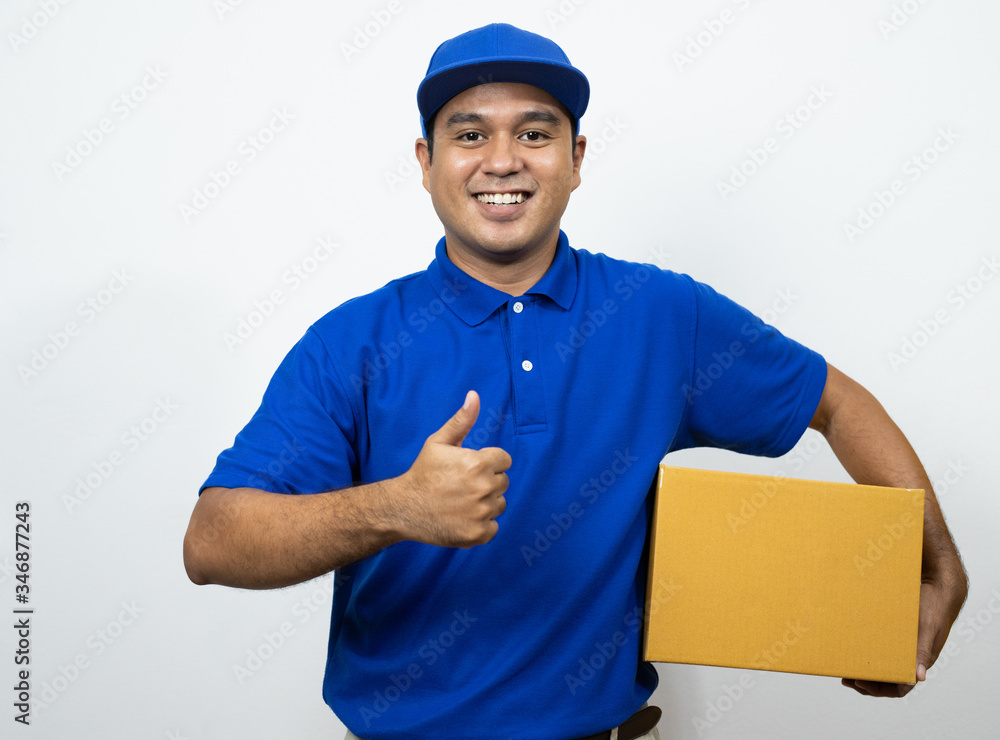 Blue Delivery handsome asian man holding parcel cardboard box on isolated white background. Blue Delivery handsome asian man holding parcel cardboard box on isolated white background.