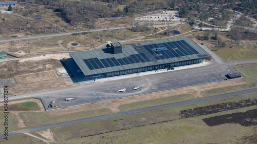 Soesterberg, The Netherlands - March 2020: Aerial photo Military Museum with American war planes on the apron. photo