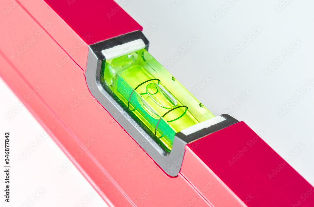 Close-up of red Spirit Levels used in construction on white background . Close-up of red Spirit Levels used in construction on white background .