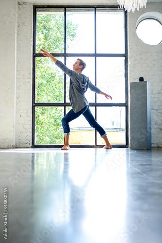 A handsome young male Ballet dancer practicing in a Loft style A © Spectral-Design