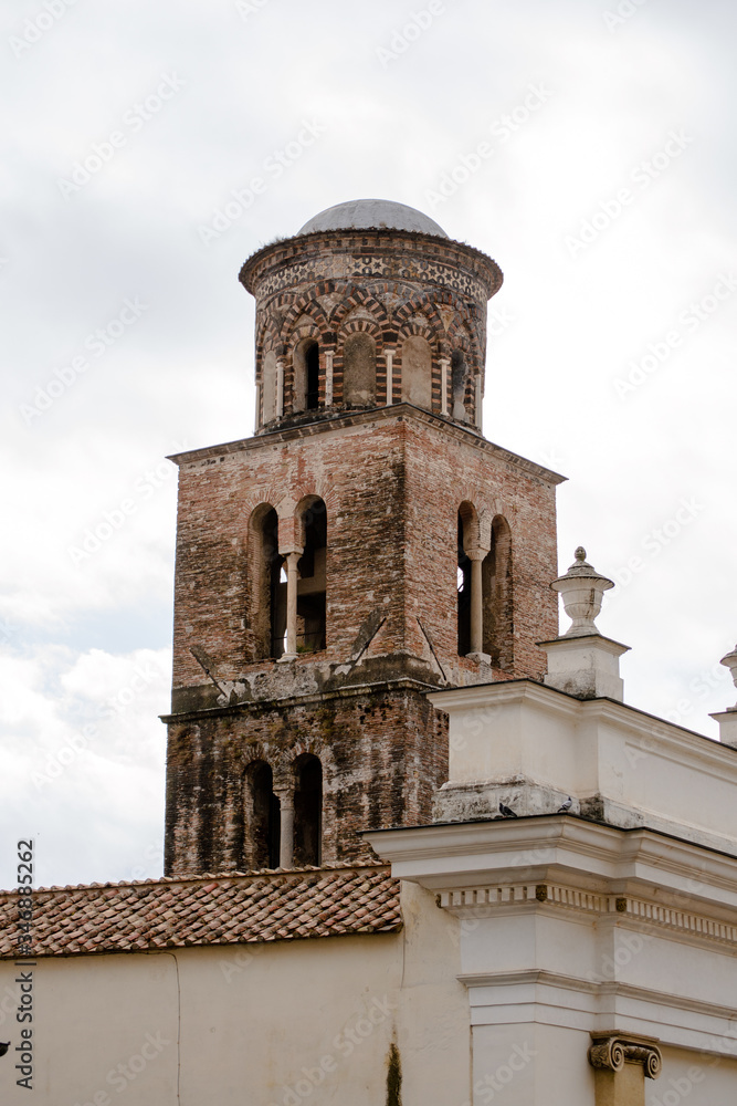 The interesting architecture of the  bell tower of the cathedral of Salerno, Italy. Its decoration derive from the influence of many culture among which there are the roman, the byzantine and norman