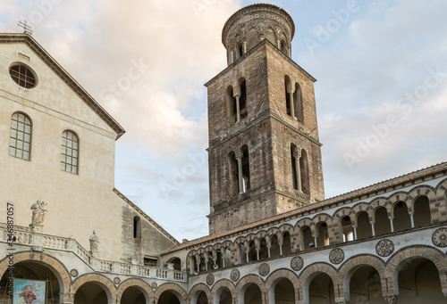 Salerno, Italy. View of the cloister of San Matteo Cathedral and its arab-normann style beautiful bell tower seen from under its porch. A everyday scene of this mediterranean pretty town