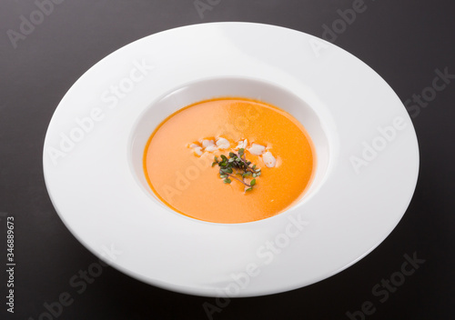 Orange pumpkin soup with prawns