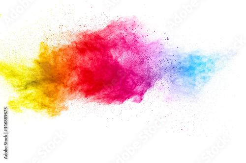 Multicolored particles explosion on white background. Colorful dust splatter. © Pattadis