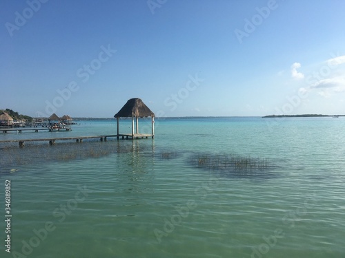Beautiful ocean view with clean blue turquoise water, sunny day. Amazing background of island, Caribbean, Lagoon Bacalar. Calm secluded place without people, paradise