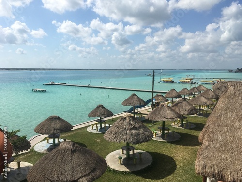 Beautiful ocean view with clean blue turquoise water, sunny day. Amazing background of island, Caribbean, Lagoon Bacalar. Calm secluded place without people, paradise