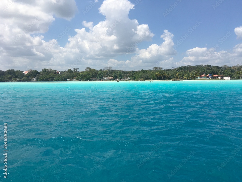 Beautiful ocean view with clean blue turquoise water, sunny day. Amazing background of island, Caribbean, Lagoon Bacalar. Calm secluded place without people, paradise