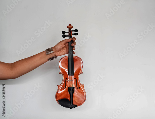 Violin was holding by human hand
