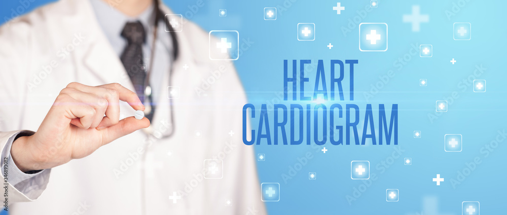 Close-up of a doctor giving a pill with HEART CARDIOGRAM inscription, medical concept Close-up of a doctor giving a pill with HEART CARDIOGRAM inscription, medical concept