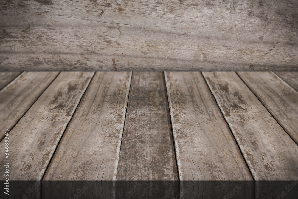 Empty wooden table top with wood wall on background Empty wooden table top with wood wall on background