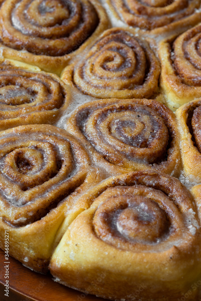 cinnamon buns close up with selected focus, vertical cinnamon buns close up with selected focus, vertical