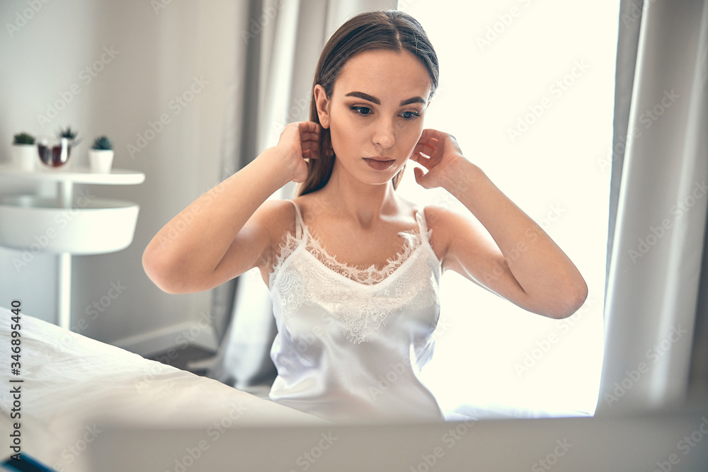Caucasian lady with beautiful makeup spending time at home Caucasian lady with beautiful makeup spending time at home
