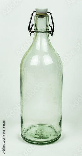 Real glass bottle isolated on white background