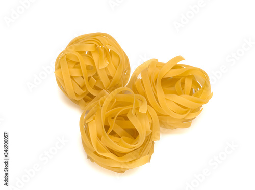 Italy dry raw pasta tagliattele close-up on white background