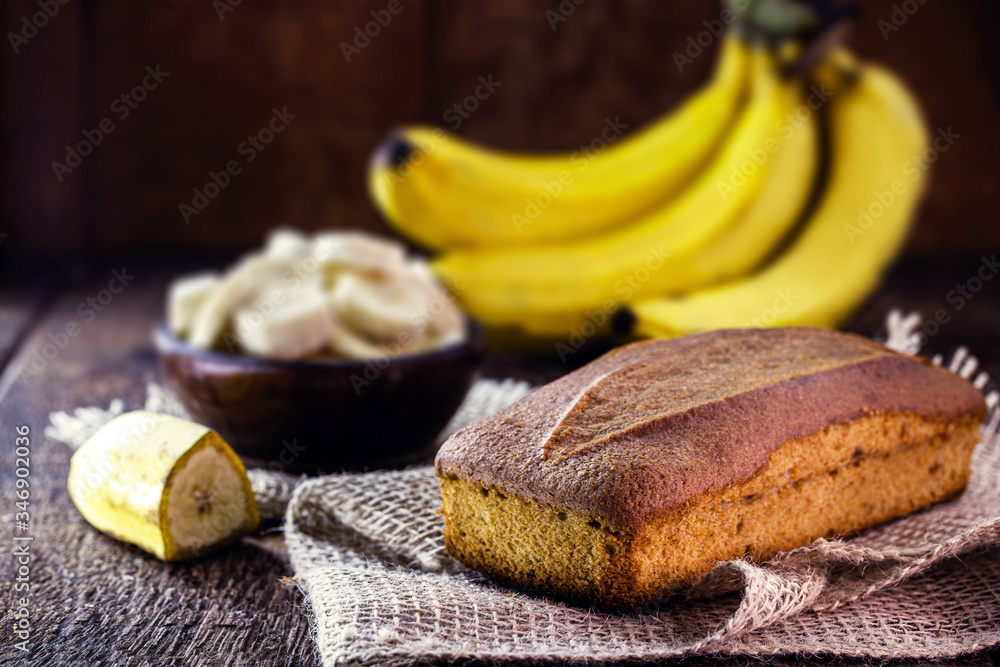 banana flavored vegan bread on rustic wooden background.