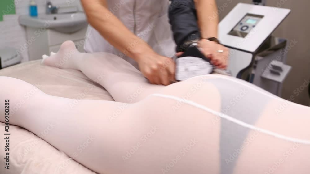 Lpg massage of a patient in a special white suit Lpg massage of a patient in a special white suit