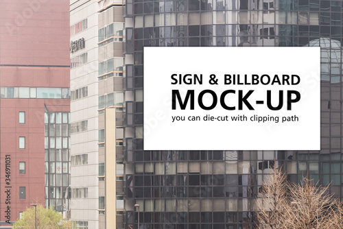 Isolated white billboard mockup on building, billboard die-cut with clipping path
