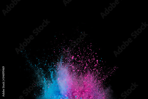 Explosion of colored powder isolated on black background. Abstract colored background © wooddy7