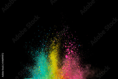 Explosion of colored powder isolated on black background. Abstract colored background