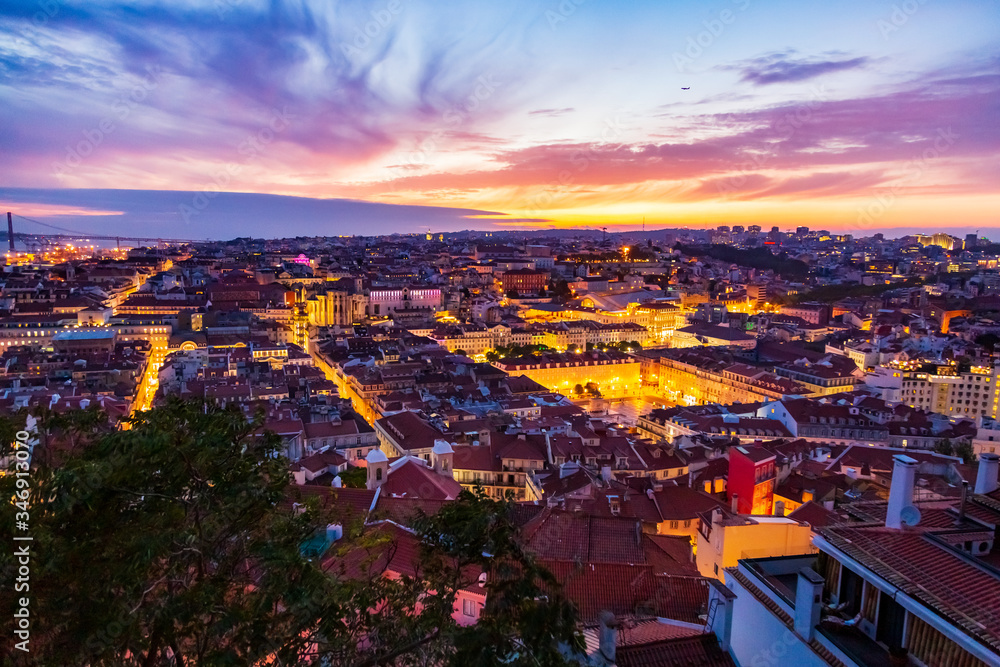 Beautiful panorama of old town and Baixa district in Lisbon city at evening, seen from Sao Jorge Castle hill, Portugal