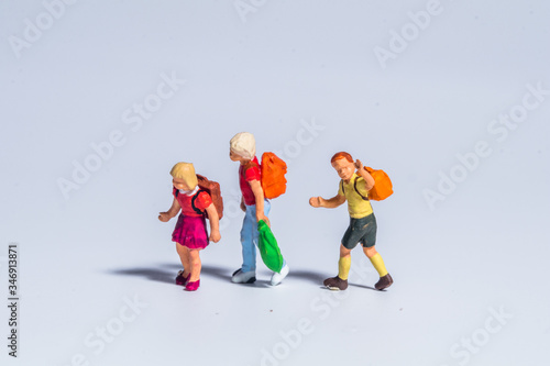 Fototapeta Naklejka Na Ścianę i Meble -  miniature figure concept of people, teenager, kids