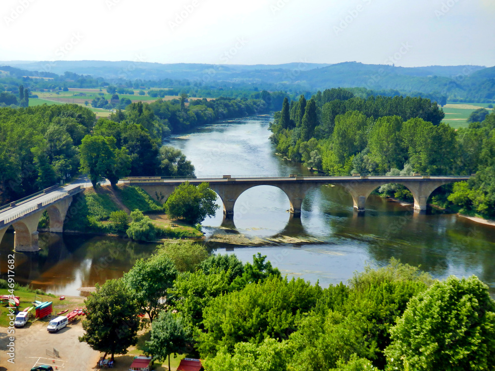 Confluence of the River Dordogne and River Vezere meeting at the village of Limeuil in the Dordogne, France