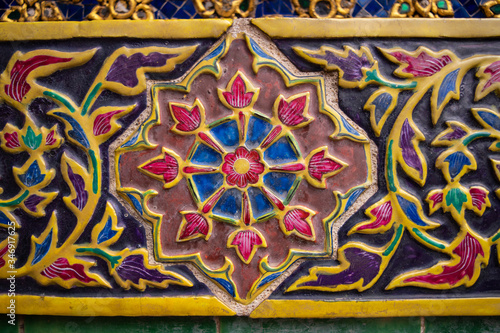 Close up of colorful thai ceramic, wall decoration of Palace in Bangkok