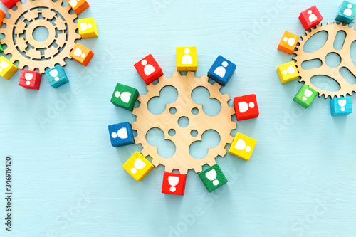image of colorful blocks with people icons over wooden table ,human resources and management concept
