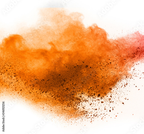 orange powder explosion isolated on white background. © wooddy7