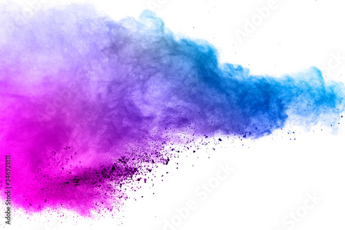 Freeze motion of colored powder explosions isolated on white background. © wooddy7
