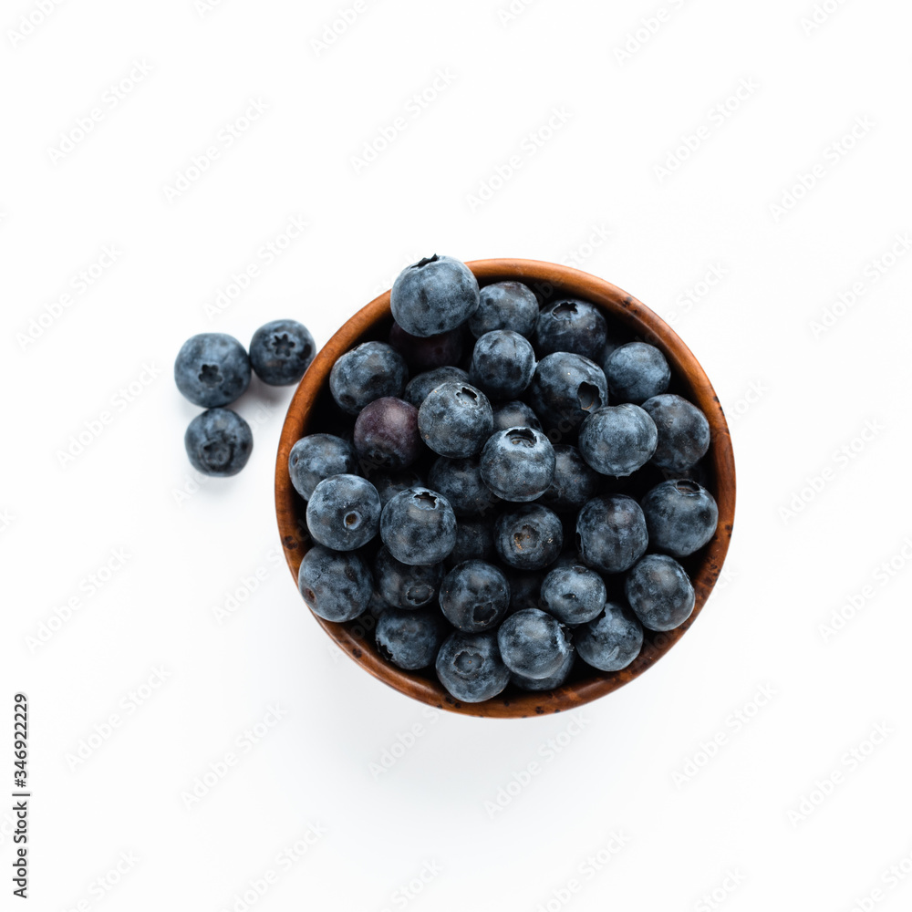 Blue berries in a wooden cup. Top View Blue berries in a wooden cup. Top View