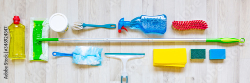 Fotografía Web banner flat lay with collection of cleaning materials on a light wooden back