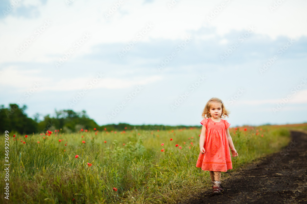 little girl goes in dirty dirt road after rain. little girl goes in dirty dirt road after rain.