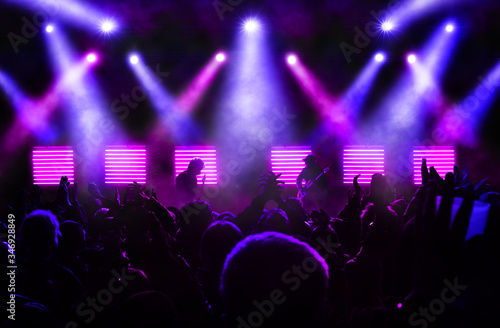 Konstfotografi Crowd watching a band performing at a music festival at night, photomontage with