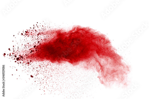 Red powder explosion on white background. Colored cloud. Colorful dust explode. Paint Holi.