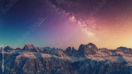 Fototapeta Naklejka Na Ścianę i Meble -  Snowy rocky mountain with a beautiful starry night, space fort text