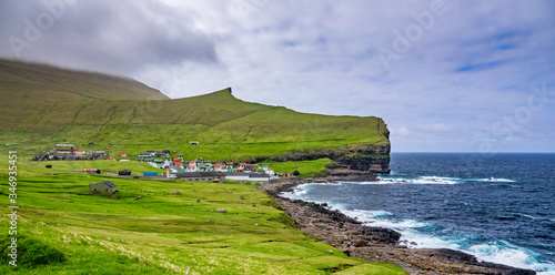 Gjov village near the ocean in Faroe Islands photo