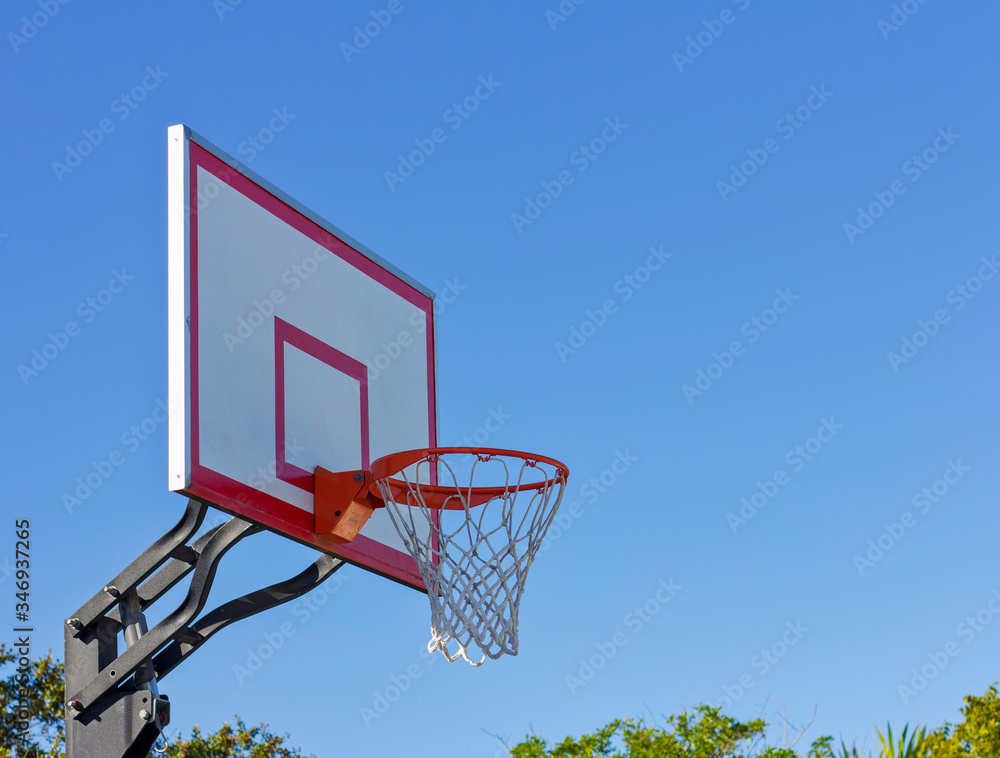 basketball hoop on blue sky background