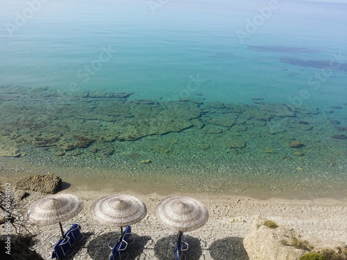 .three umbrellas and the sea