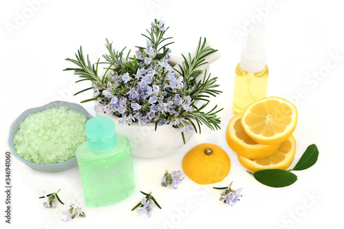 Rosemary herb & lemon skin care vegan beauty treatment with aromatherapy moisturising oil, gel & ex foliation salts on white. Anti ageing benefits & helps to reduce environmental skin damage.   photo