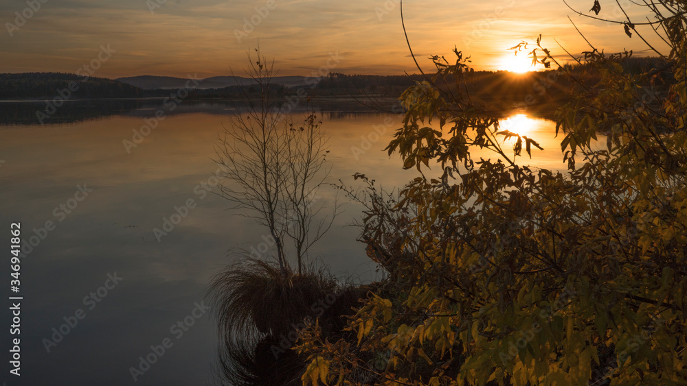 Sunset on an autumn evening on a lake Sunset on an autumn evening on a lake