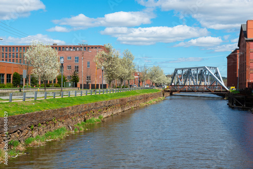 Historic Pemberton Mill Bridge on the Merrimack River North Canal at Lawrence Heritage State Park in downtown Lawrence, Massachusetts MA, USA.  photo