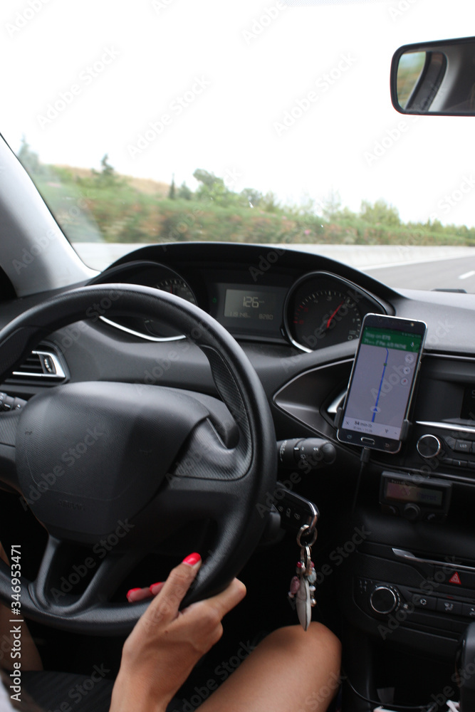 Woman in modern car driving on the highway Woman in modern car driving on the highway