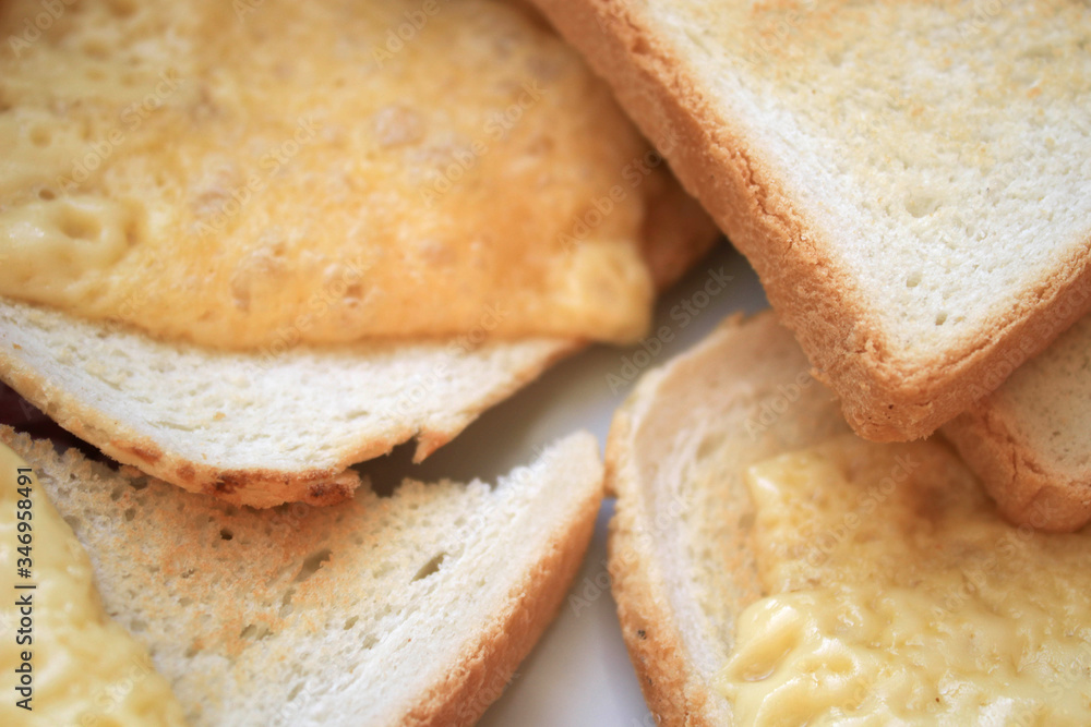 Several pieces of bread with cheese